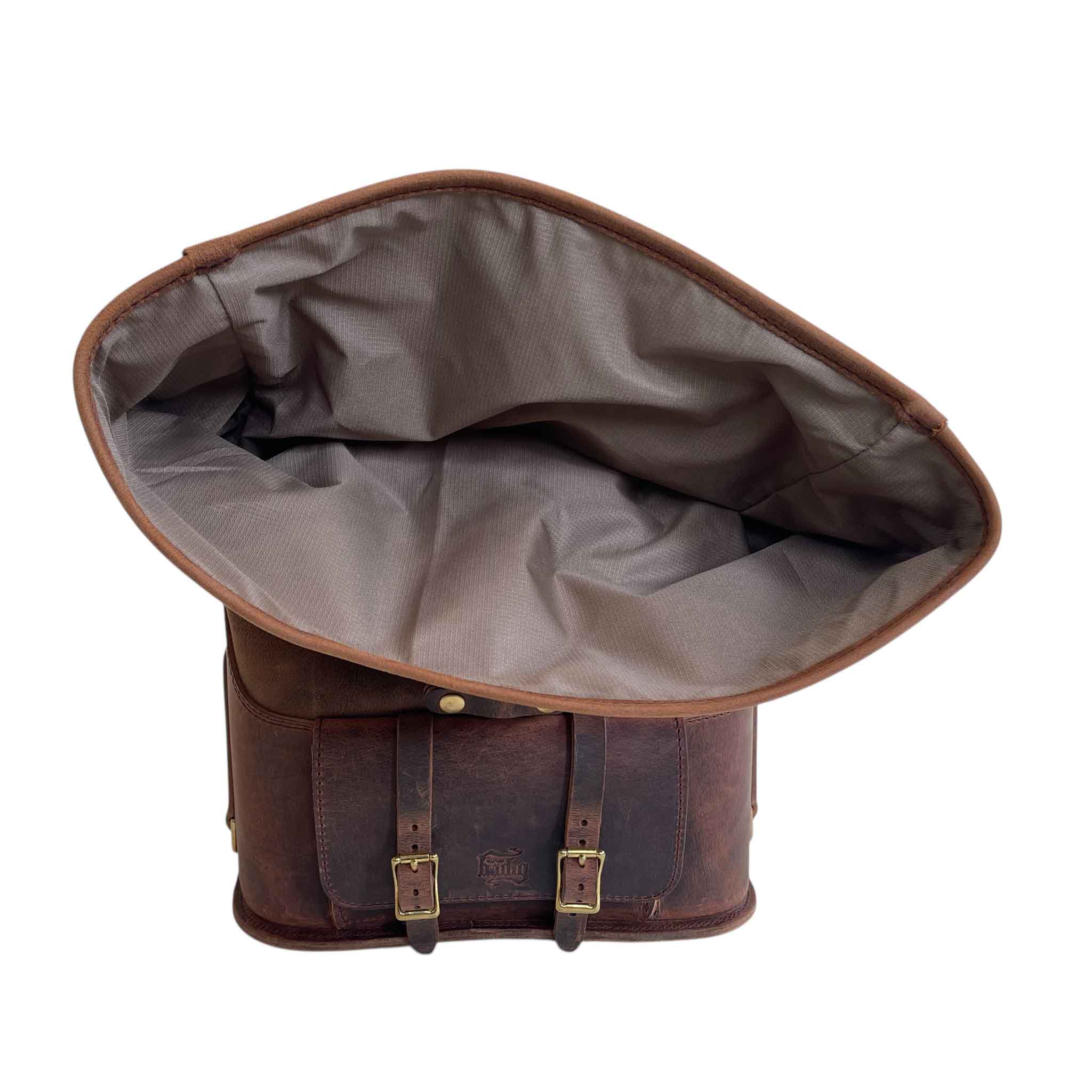 Triumph Bonneville Bobber Panniers Rolltop Swingarm Saddlebags. Hand crafted in USA with premium veg tan water buffalo leather, waterproof liners and solid brass hardware. BAD&G Customs TBP01