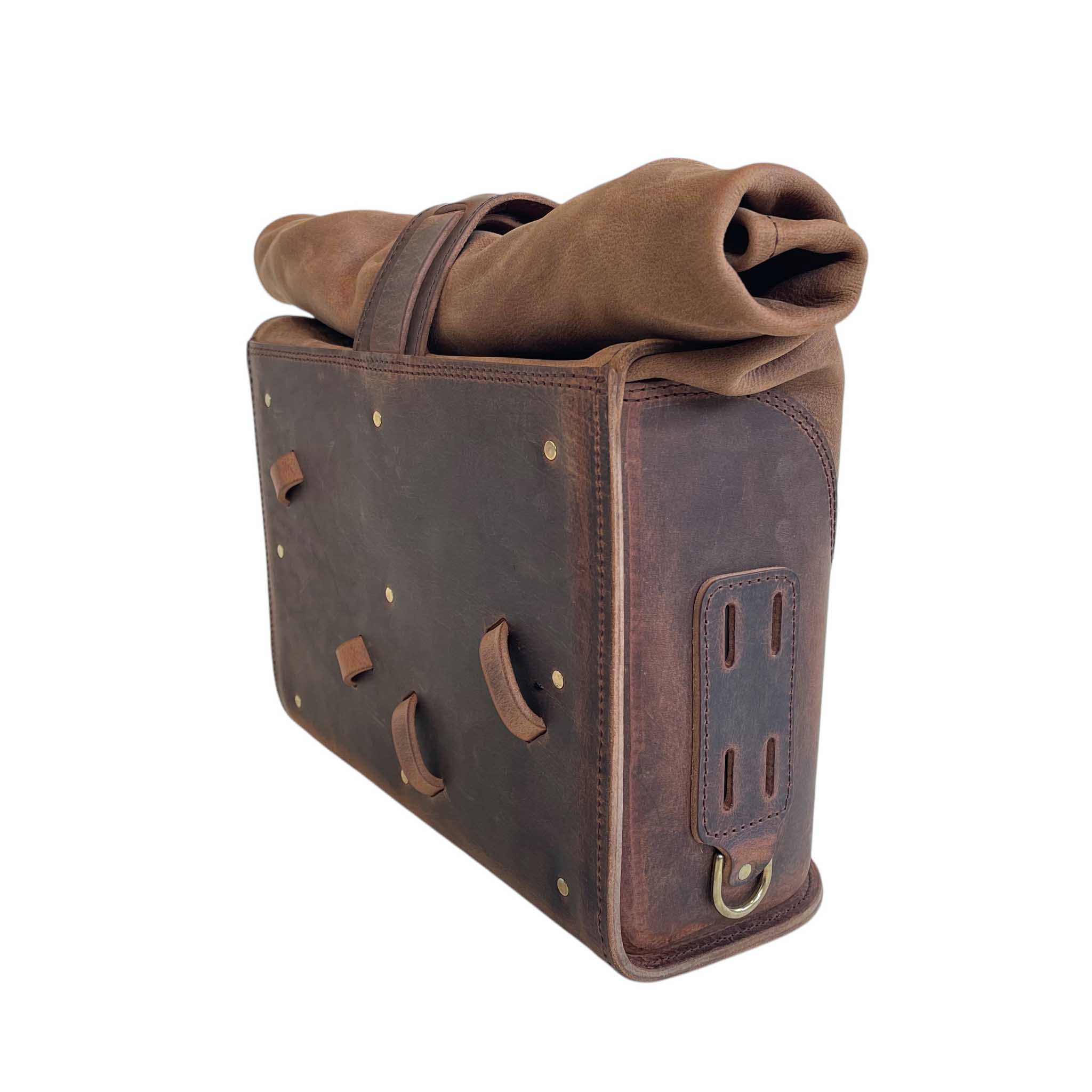 Triumph Bonneville Bobber Panniers Rolltop Swingarm Saddlebags. Hand crafted in USA with premium veg tan water buffalo leather, waterproof liners and solid brass hardware. BAD&G Customs TBP01