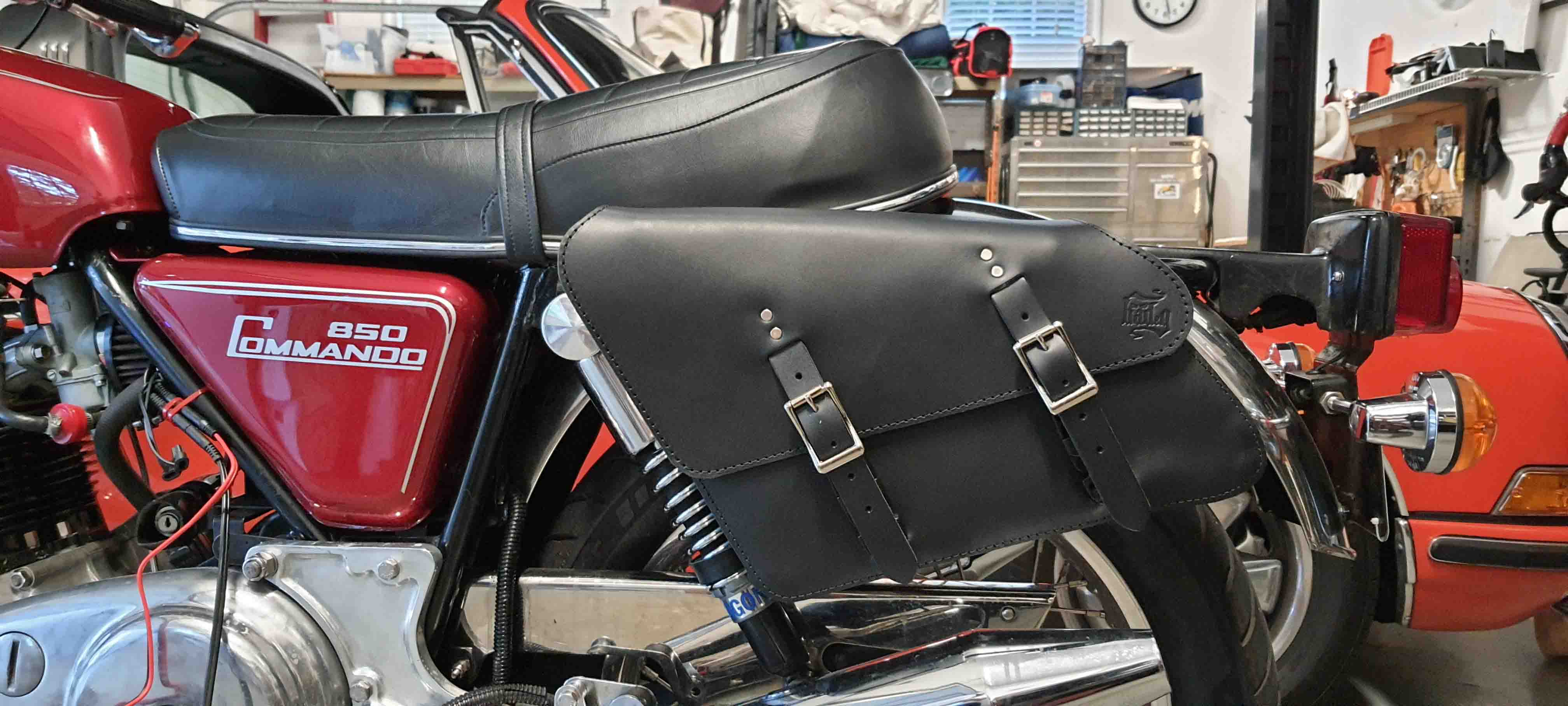 Norton Commando 850 classic motorcycle with vintage design and premium custom leather saddlebags for a perfect fit and timeless style.