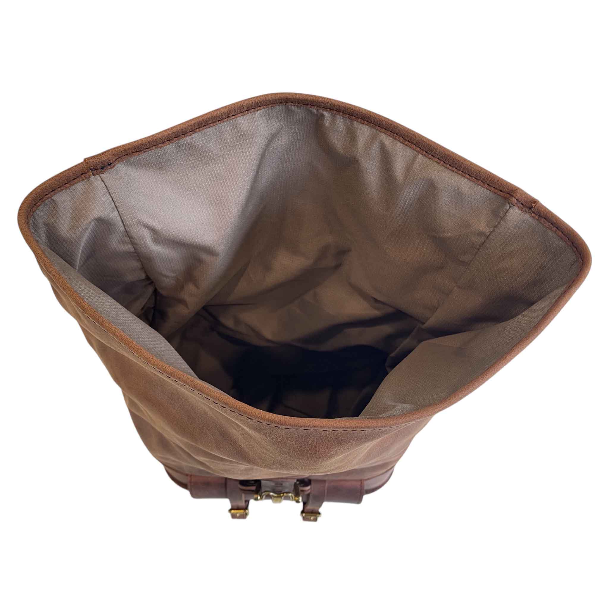 Triumph Bonneville Bobber Panniers Rolltop Swingarm Saddlebags. Hand crafted in USA with premium veg tan water buffalo leather, waterproof liners and solid brass hardware. BAD&G Customs TBP01