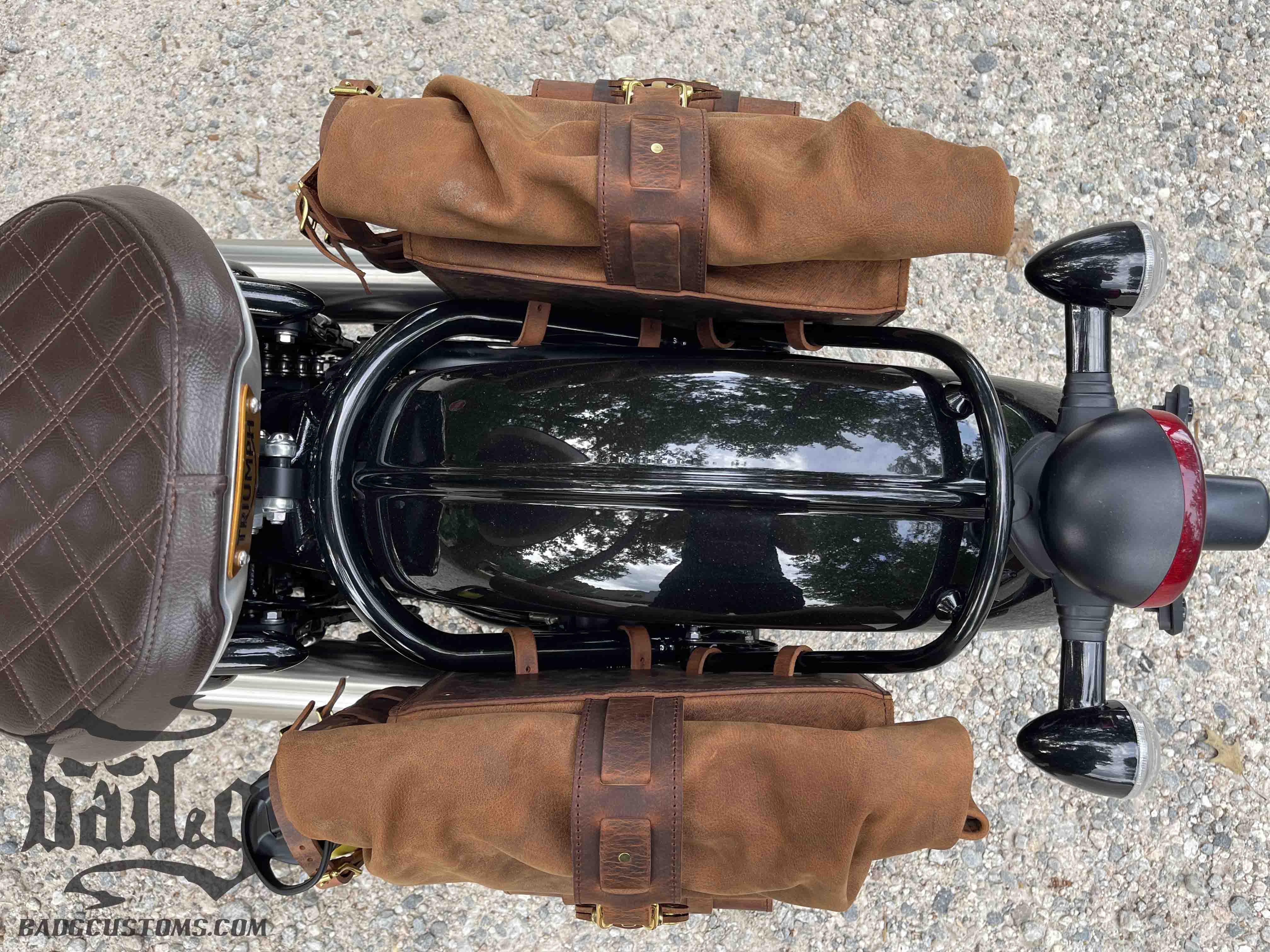 Triumph Bonneville Bobber Panniers Rolltop Swingarm Saddlebags. Hand crafted in USA with premium veg tan water buffalo leather, waterproof liners and solid brass hardware. BAD&G Customs TBP01